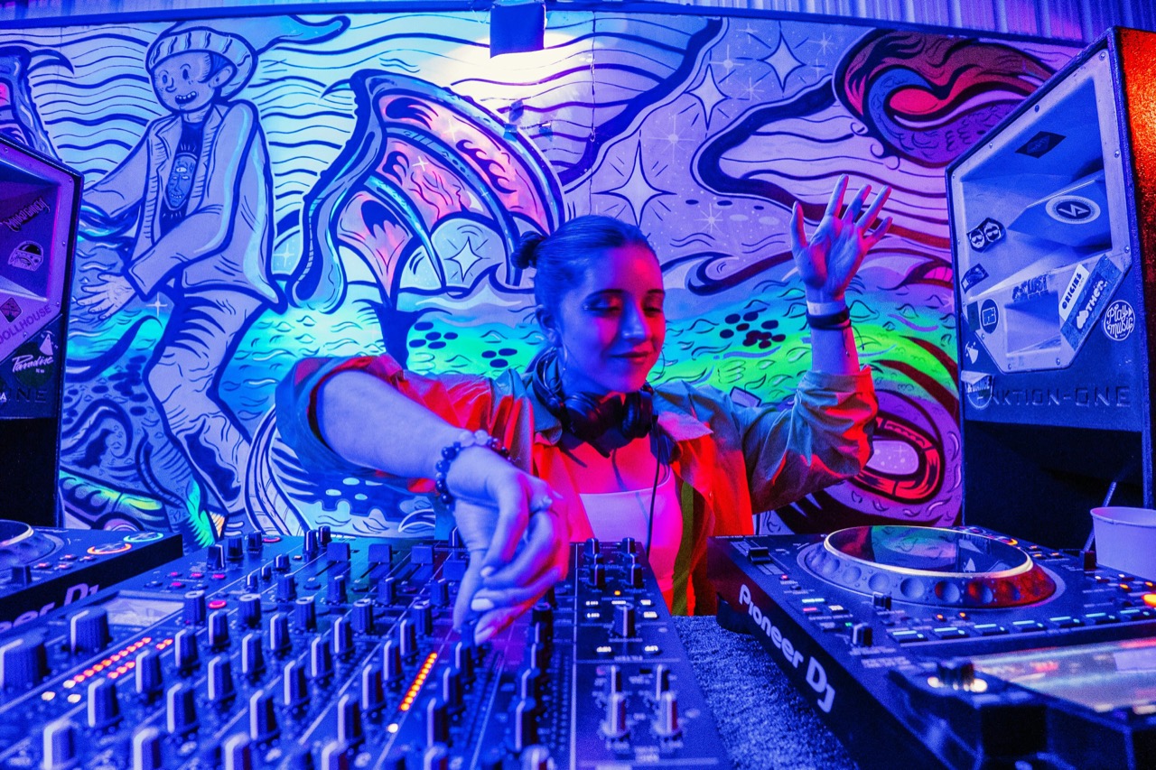 A DJ working through keys on the decks.