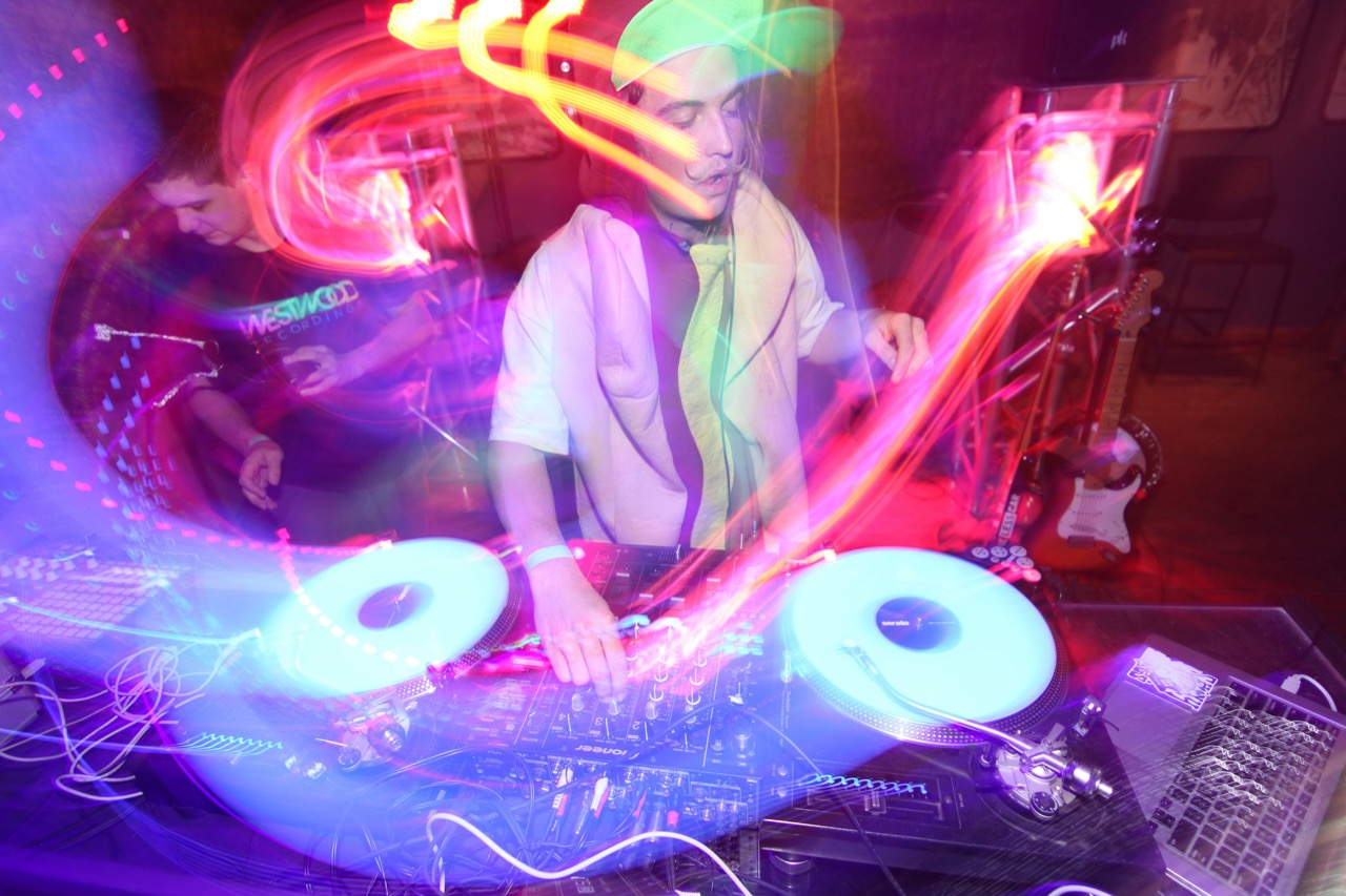 A DJ at the station, having fun while listening for a track’s key.